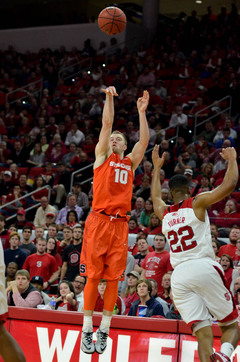 Cooney unleashes a 3 as Turner approaches the SU guard to defend.