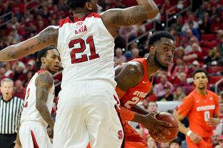 Christmas bodies up N.C. State center BeeJay Anya under the hoop. Christmas finished his career with a 15-point showing on Saturday.