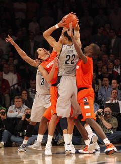 Michael Carter-Williams and Baye Moussa Keita defend against Georgetown's Otto Porter (#22) in overtime.