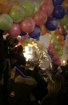 Balloons in front of Alpha Phi sink under the weight of snow while sisters celebrate in the sorority's front yard. 