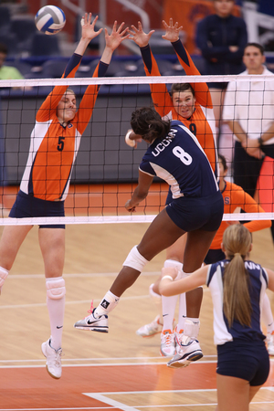 Syracuse middle blocker Samantha Hinz goes for a block in the Orange's loss to Connecticut on Sunday in the Carrier Dome.