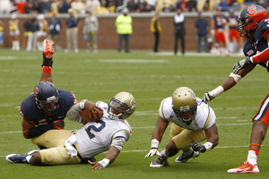 Marqez Hodge drags down Georgia Tech quarterback Vad Lee. The freshman linebacker recorded 12 tackles in his first-career start.