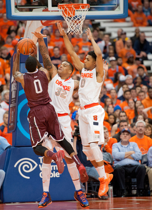 DaJuan Coleman (32) and Michael Gbinije (0) contest a shot. Coleman and the other Syracuse centers have improved defensively this season.