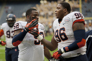 Eric Crume (left) and Jay Bromley slap hands during Syracuse's 21-17 win against Minnesota in the Texas bowl. Crume will take Bromley's role as leader of the front four next season.