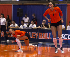 Nicolette Serratore (right) and a teammate celebrate during Syracuse's 3-2 win over Virginia Tech. 