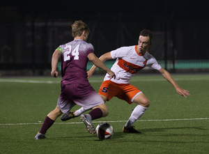 Freshman defender Justin Earle and the Orange stifled the Colgate Raiders defense. 