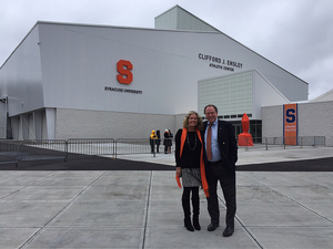 Ensley and his wife, Sue, stand in front of the Ensley Athletic Center, which he helped finance.