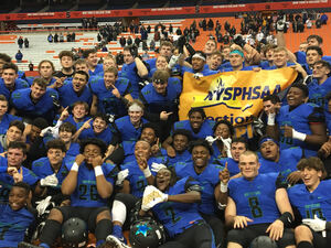 The Northstars crowded around the Section III championship banner after repeating as Class AA champs on Saturday night in the Carrier Dome.