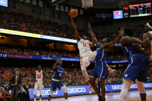 Oshae Brissett drives to the rim in SU's win over the Bulls last year.