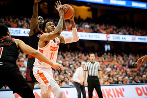 Oshae Brissett muscles underneath the rim.