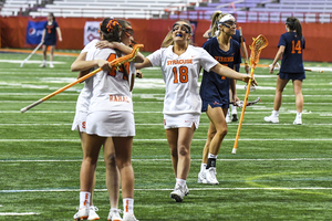 Syracuse celebrates after a goal against Virginia earlier in the season.