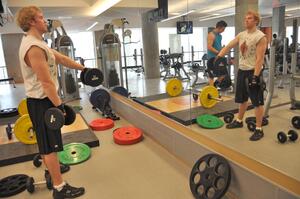 Danny Rich, a senior chemical engineering major, lifts weights in the Ernie Davis Fitness Center. SU was praised for providing health and wellness options to students.