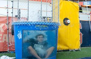 Josh Fishman, co-project leader for Do One Thing and senior marketing and entrepreneurship and emerging enterprise major, sported a UConn T-shirt in the dunktank at the mens basketball game on Saturday. Fishman and DOT helped raise money for the World Wildlife Fund.