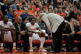 Jim Boeheim talks Jerami Grant as the freshman is seated on the bench.