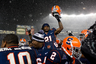 Safety Shamarko Thomas raises his helmet to the sky in celebration on the sideline toward the end of the fourth quarter.