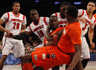 Baye Moussa Keita (#12) fights for an offensive rebound.