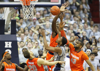 Rakeem Christmas and James Southerland go up to block a shot.