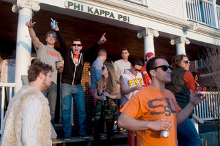 The brothers of Phi Kappa Psi celebrate Syracuse's win over Marquette.