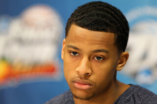 Trey Burke (3) of the Michigan Wolverines looks on during the Final Four interviews.