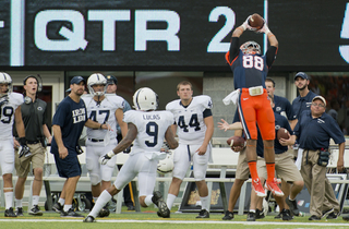 Jarrod West rises up to try and corral a pass from Syracuse quarterback Drew Allen in the second quarter. 