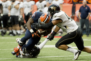 Jerome Smith plows forward. Smith finished with 17 carries for 62 yards and sparked the SU offense early in the second half after a lethargic start. 