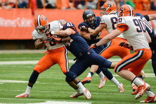 H-back Corey Winfield attempts to escape Eric Anthony's tackle.