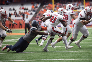 Dayes tries to shake off an Orange defender.