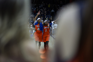 Peterson and Sykes walk off the court, hugging each other. 