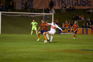 Sondre Norheim defends a Clemson attacker.