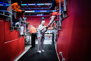 Boeheim signs a few signatures as he walks off the floor for the last time until Friday's game against TCU.