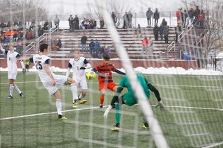 Raposo watches as the ball sailed towards the net.