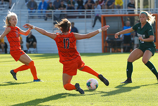 Junior Mackenzie Vlachos takes control of the ball in the match against Siena.