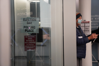 Voters wear masks at the polls and sanitize their hands as they enter in order to prevent the spread of COVID-19.