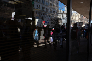 Demonstrators march through downtown Syracuse.