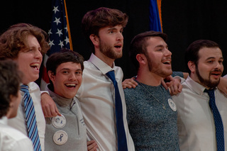 OttoTunes takes the stage for a second time to sing “Home (I Am)” by George Kamel. The group was joined by former Remembrance Scholar and Otto Tunes member Matt Sala. 